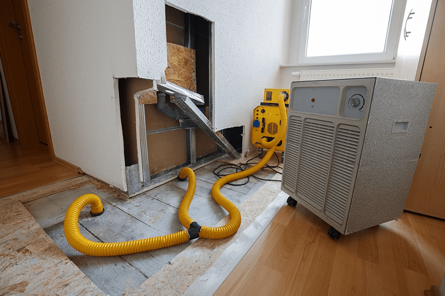 water extraction machine that is flushing water out of a room